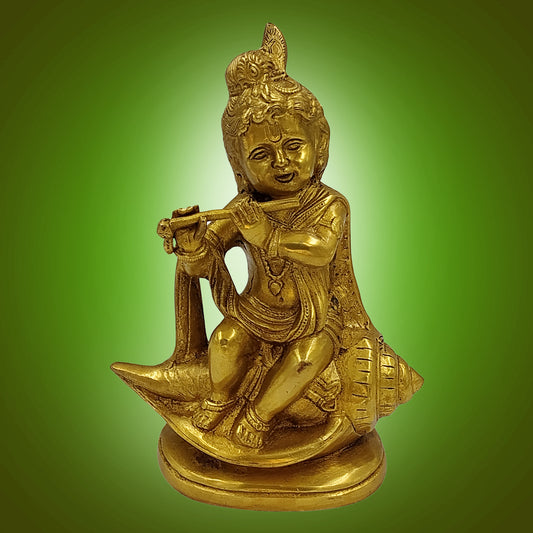 Brass Krishna Seated on Shankh, Flute in Hand, Golden Finish